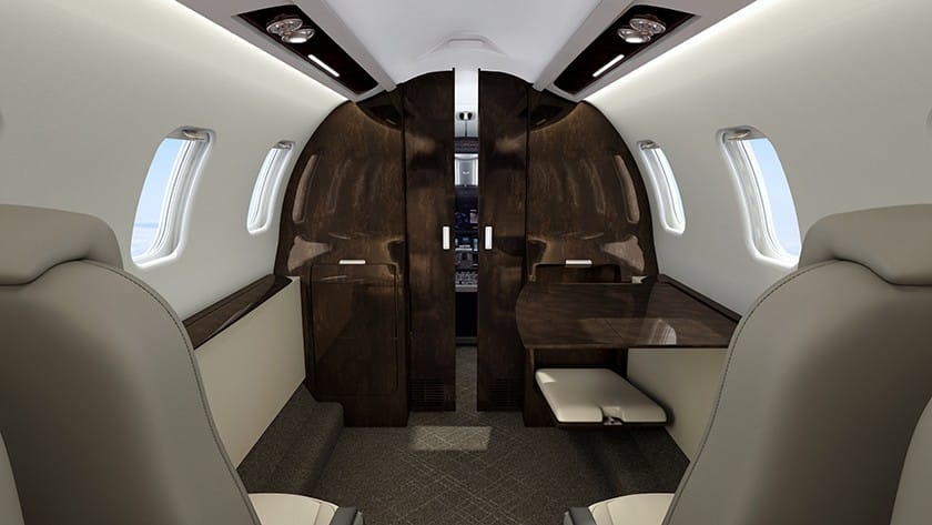 Jet privé Learjet 75 intérieur en bois brun et cuir blanc